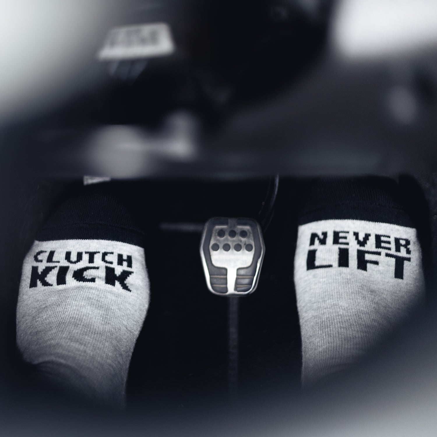 Hoonigan NEVER LIFT Socks featuring a bold design with the Hoonigan logo in white against a black background.