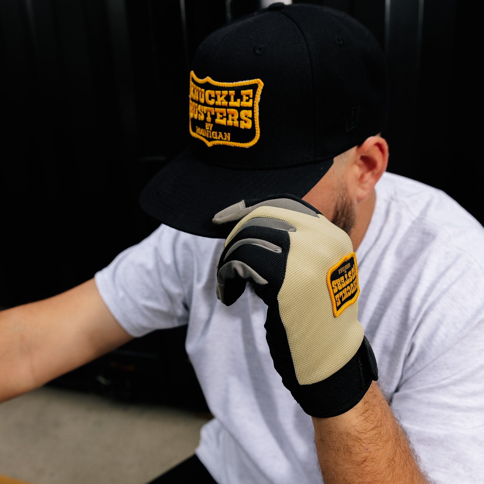 Hoonigan BELT SANDER Snapback Hat in black with white logo and adjustable strap.