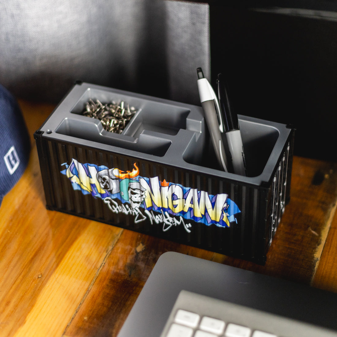Hoonigan X Spen1 miniature shipping container in vibrant colors with detailed graphics.