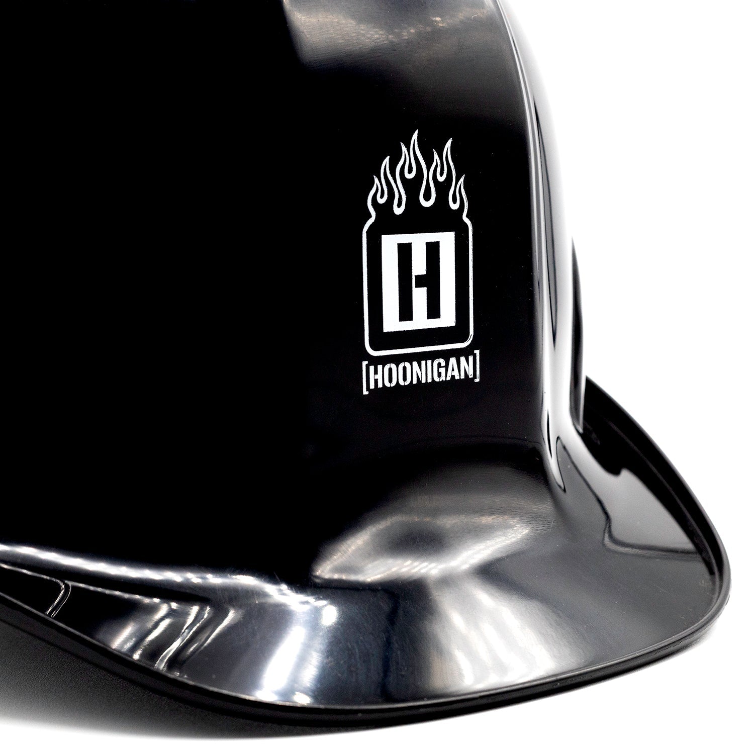 Hoonigan SAFETY THIRD Hard Hat in black with bold white logo and text design, showcasing a modern protective helmet for construction and motorsport use.