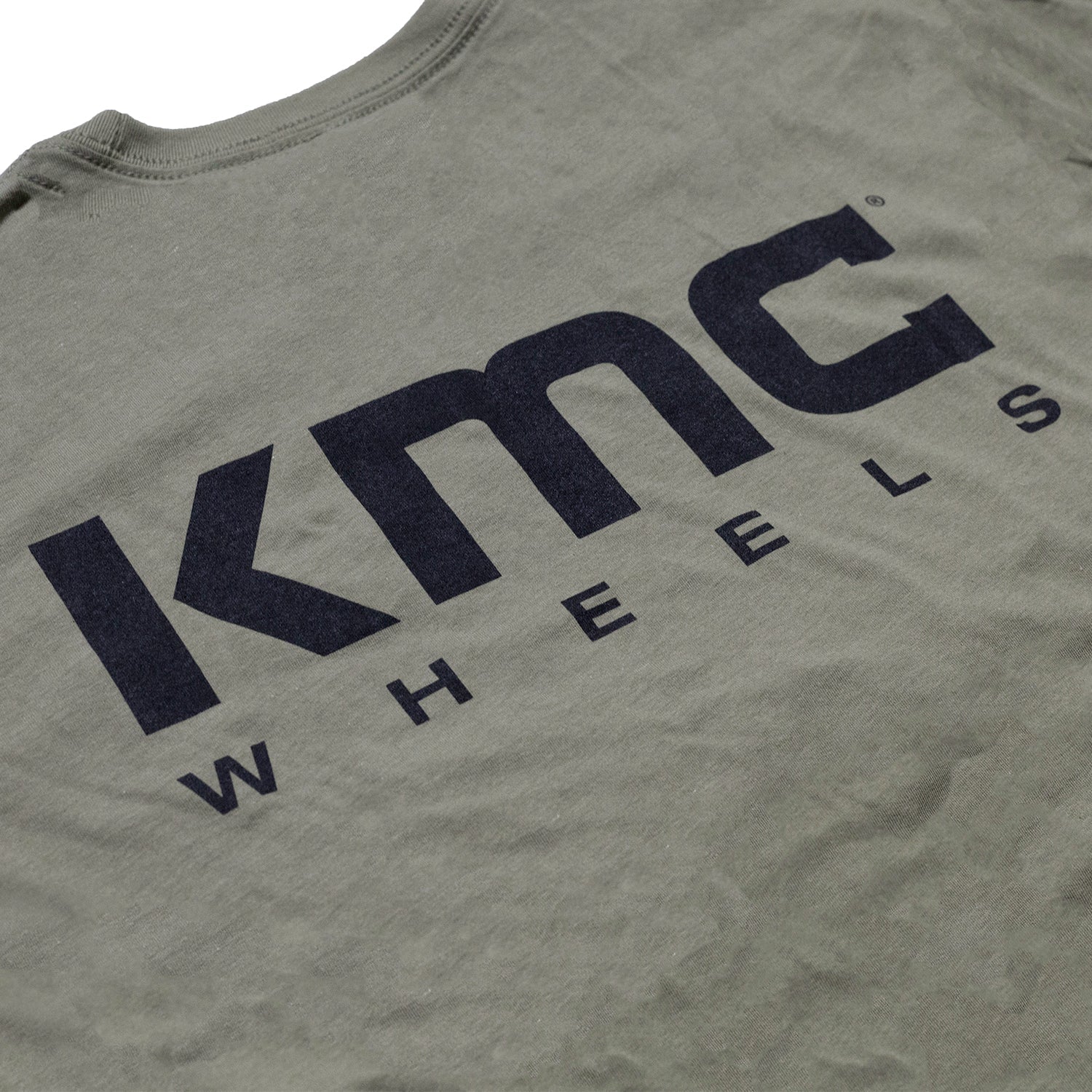 KMC Logo Short Sleeve Tee in navy blue, featuring a prominent white KMC logo on the front.