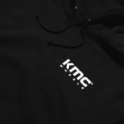 KMC Serape Hoodie featuring a colorful, patterned design with a front logo.
