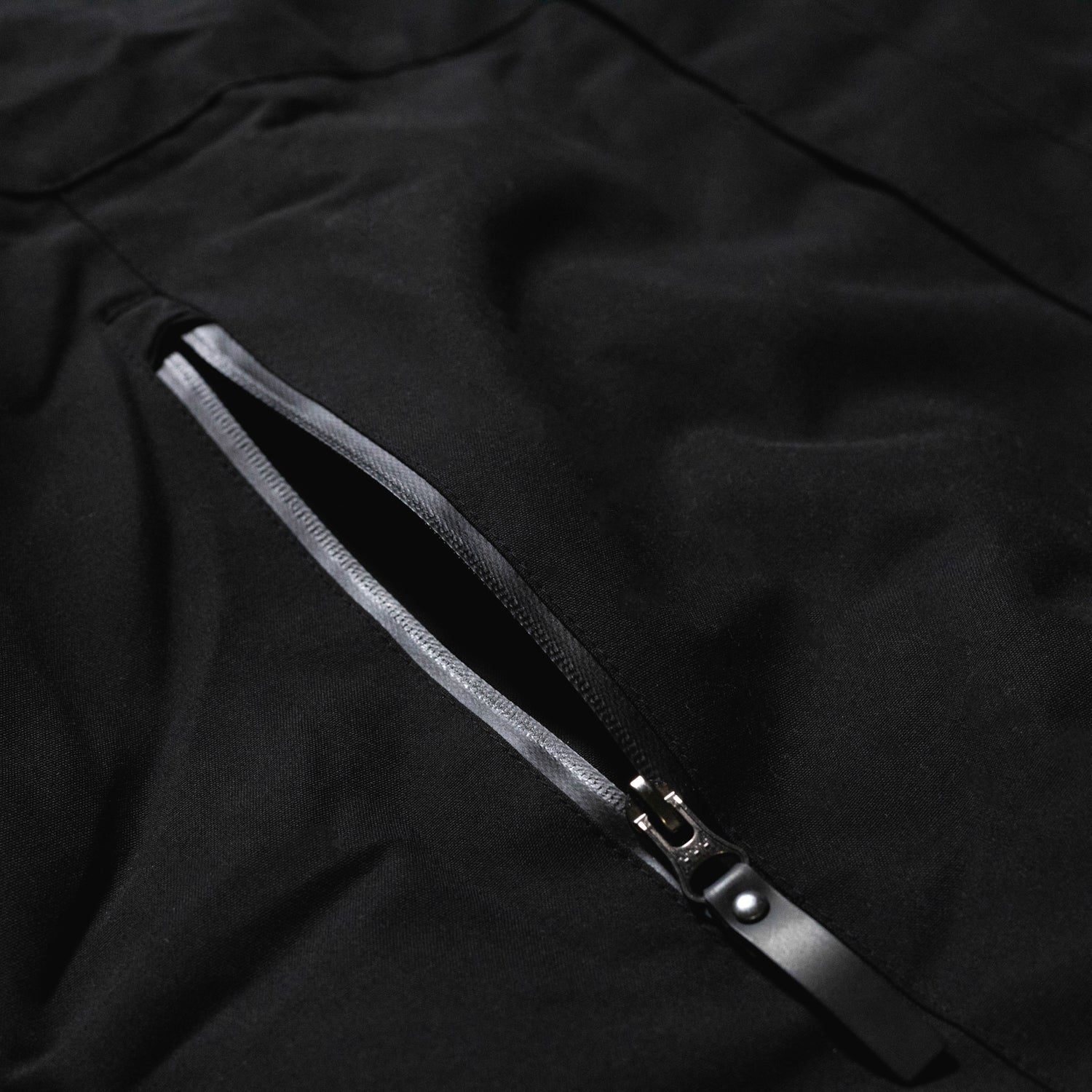 Rotiform Motorsports DIV reflective jacket featuring a sleek design with logo detailing and high-visibility reflective elements for safety.