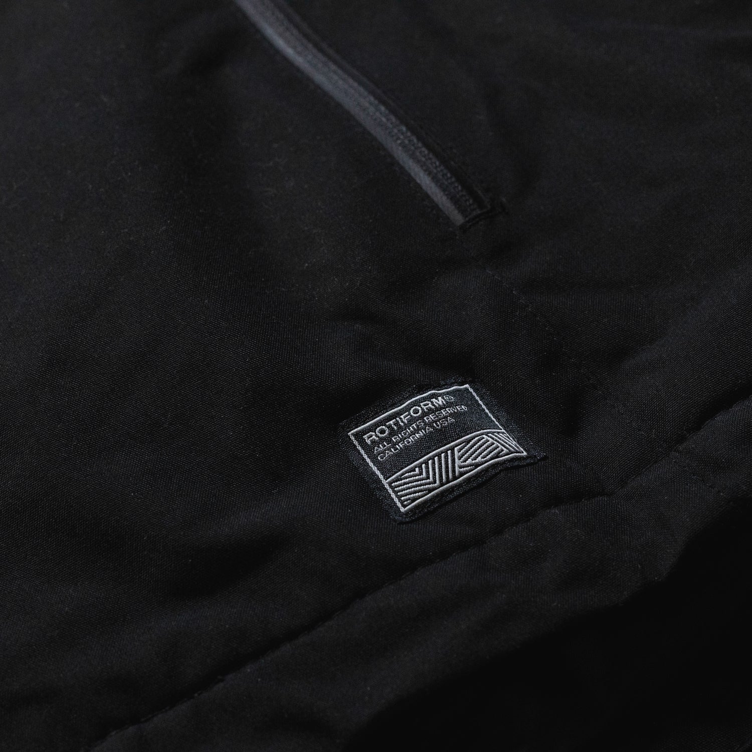 Rotiform MOTOSPORTS DIV reflective jacket featuring a sleek design, zippered front, and bright reflective detailing for visibility.