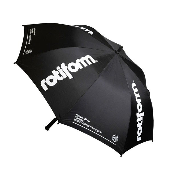 Black Rotiform SHADE SEEKER umbrella featuring bold white branding, designed for automotive enthusiasts and outdoor use.