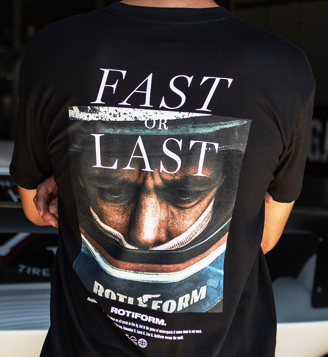 Back view of the Rotiform FAST OR LAST Short Sleeve Tee in black, featuring a bold graphic design.