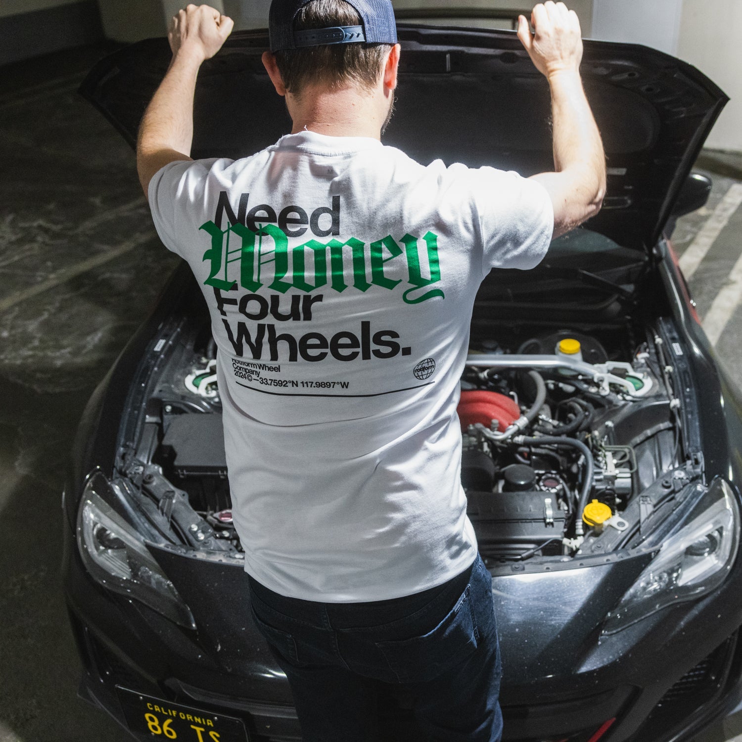 Rotiform NEED WHEELS Short Sleeve Tee featuring a bold graphic design on a black background, showcasing the Rotiform logo and automotive theme.