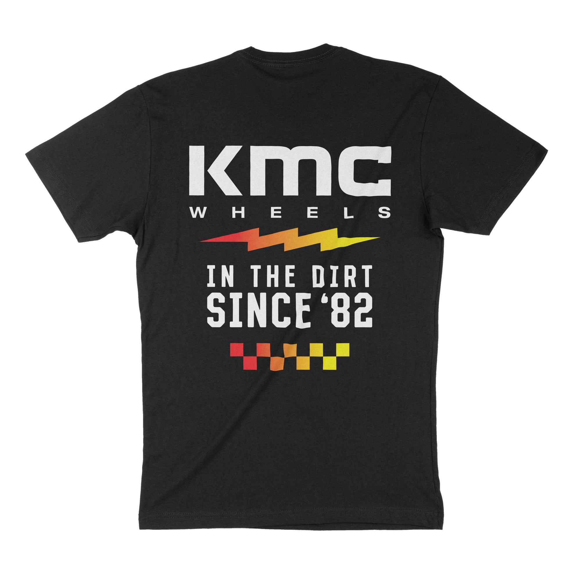 Black short sleeve t-shirt featuring KMC Wheels logo and "In the Dirt Since '82" graphic on the back. Ideal for motorsport enthusiasts.