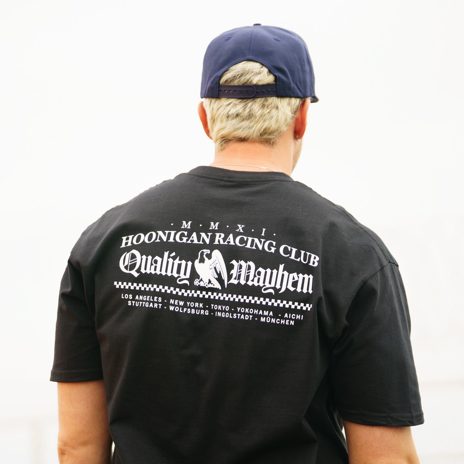 Hoonigan CHAPTERS Short Sleeve Tee in black featuring a bold graphic design on the front.