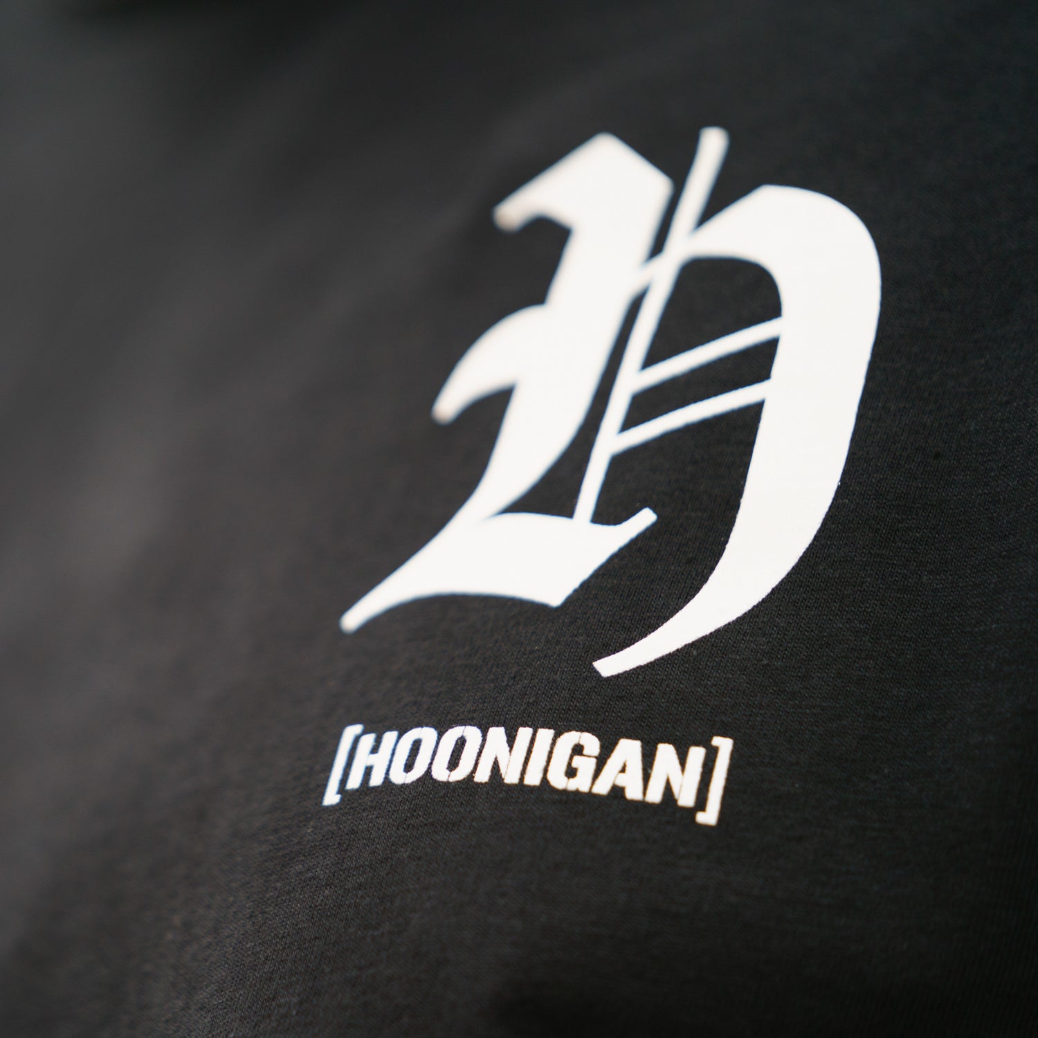 Hoonigan CHAPTERS Short Sleeve Tee in black, featuring a bold graphic print on the front, round neckline, and relaxed fit.