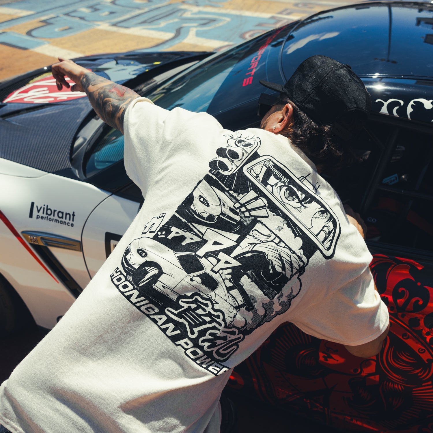 Hoonigan ON SITE Short Sleeve Tee in black featuring a bold white graphic logo on the front.