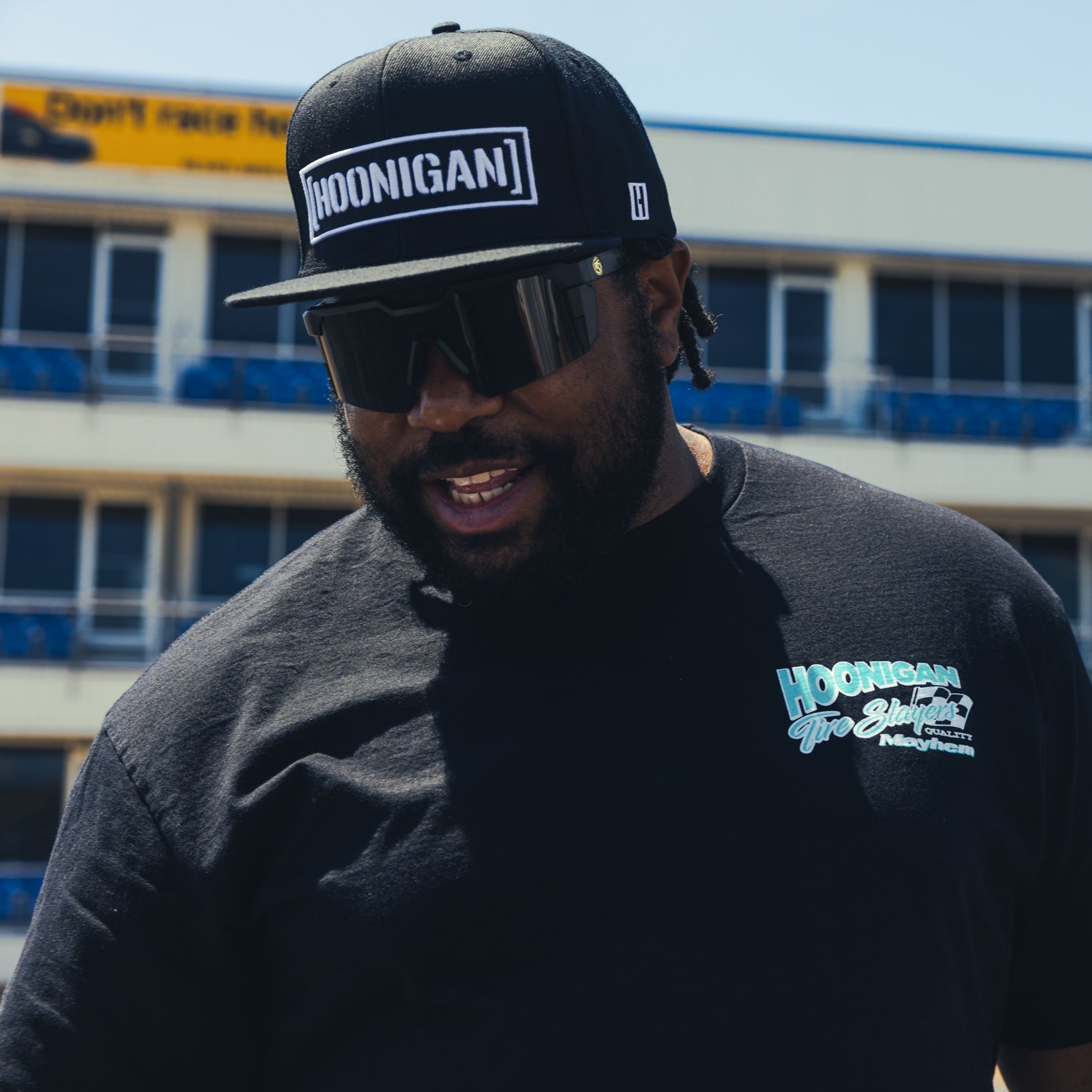 Hoonigan 86 TIRE SLAYERS Short Sleeve Tee featuring a bold graphic design and a casual fit in black.