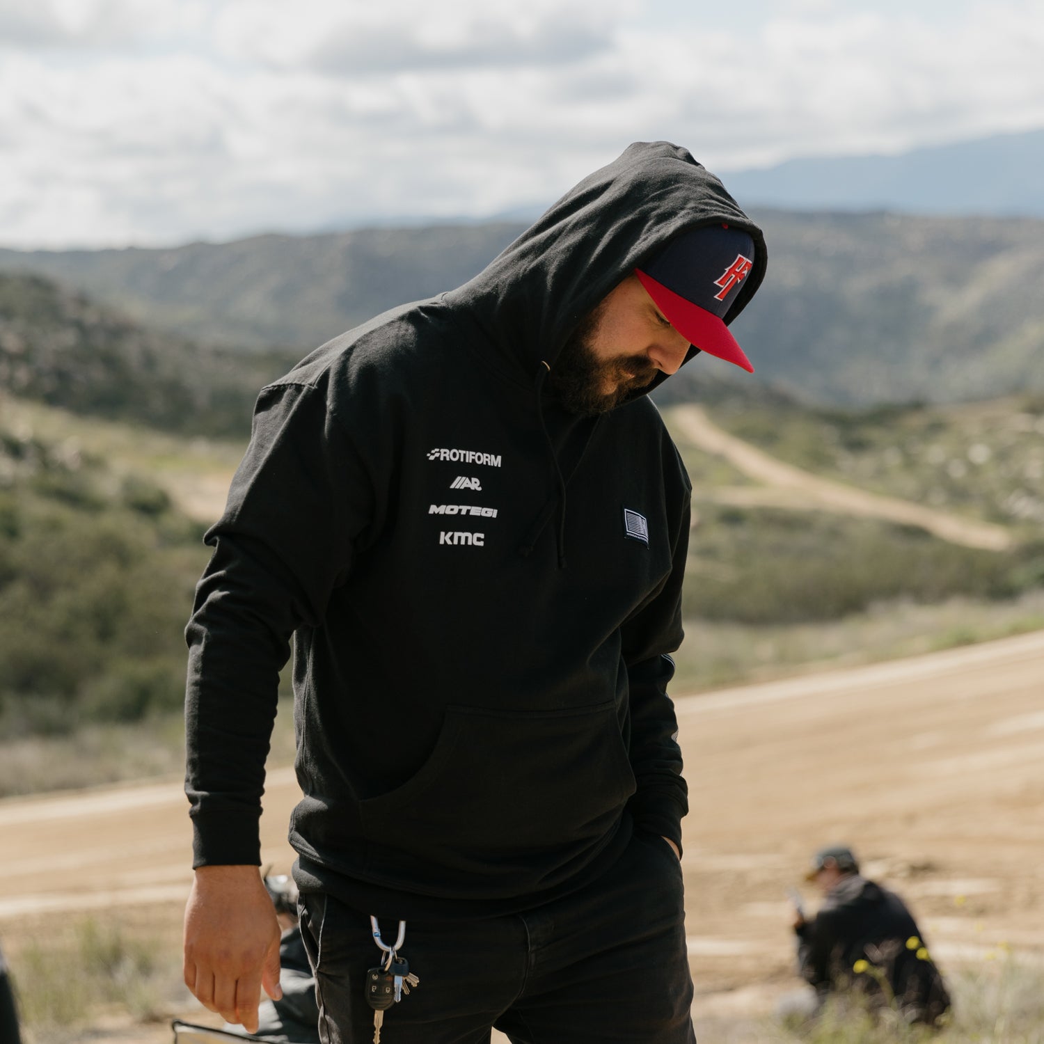 Hoonigan Motorsports black pullover hoodie with logo on the front, featuring a drawstring hood and kangaroo pocket.