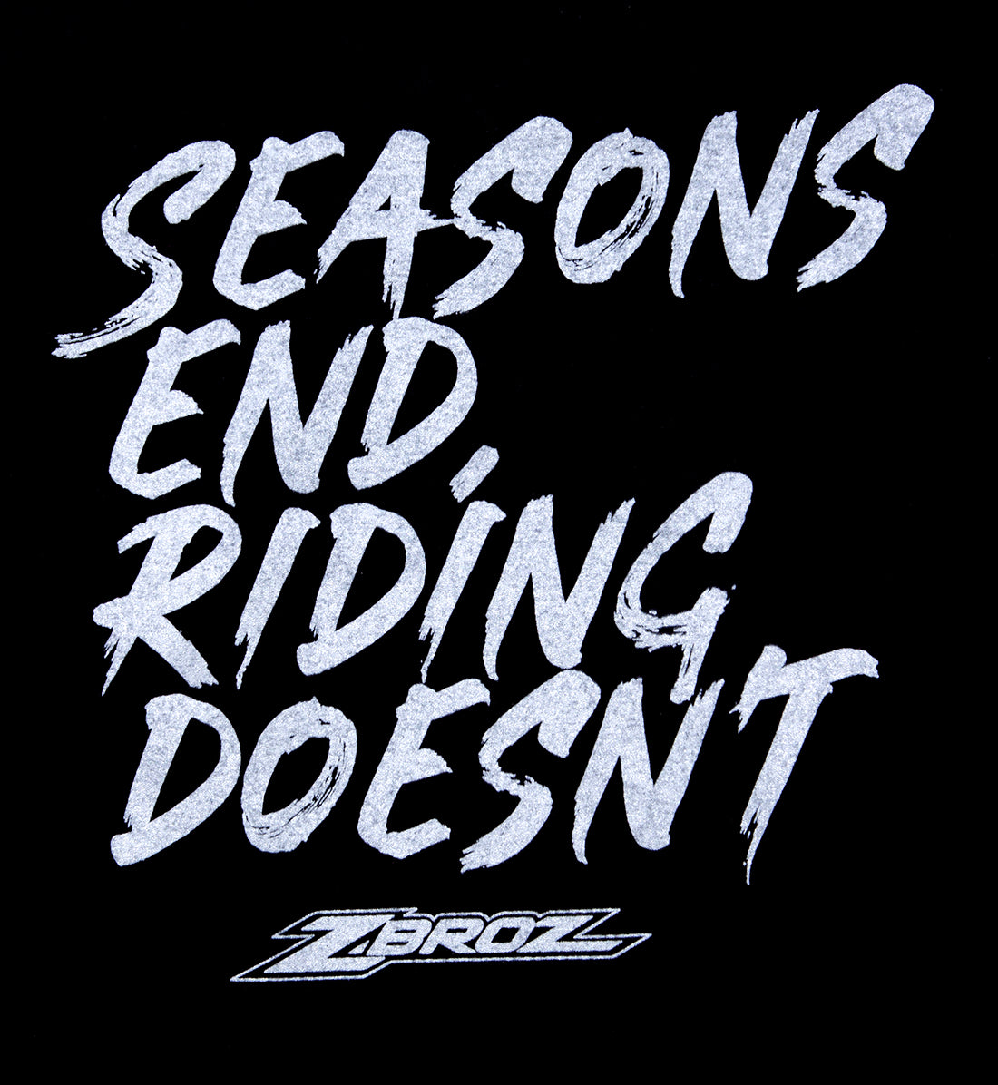 Black short sleeve ZBROZ SEASONS NEVER END tee featuring a bold "Riding Doesn't End" graphic on the back.