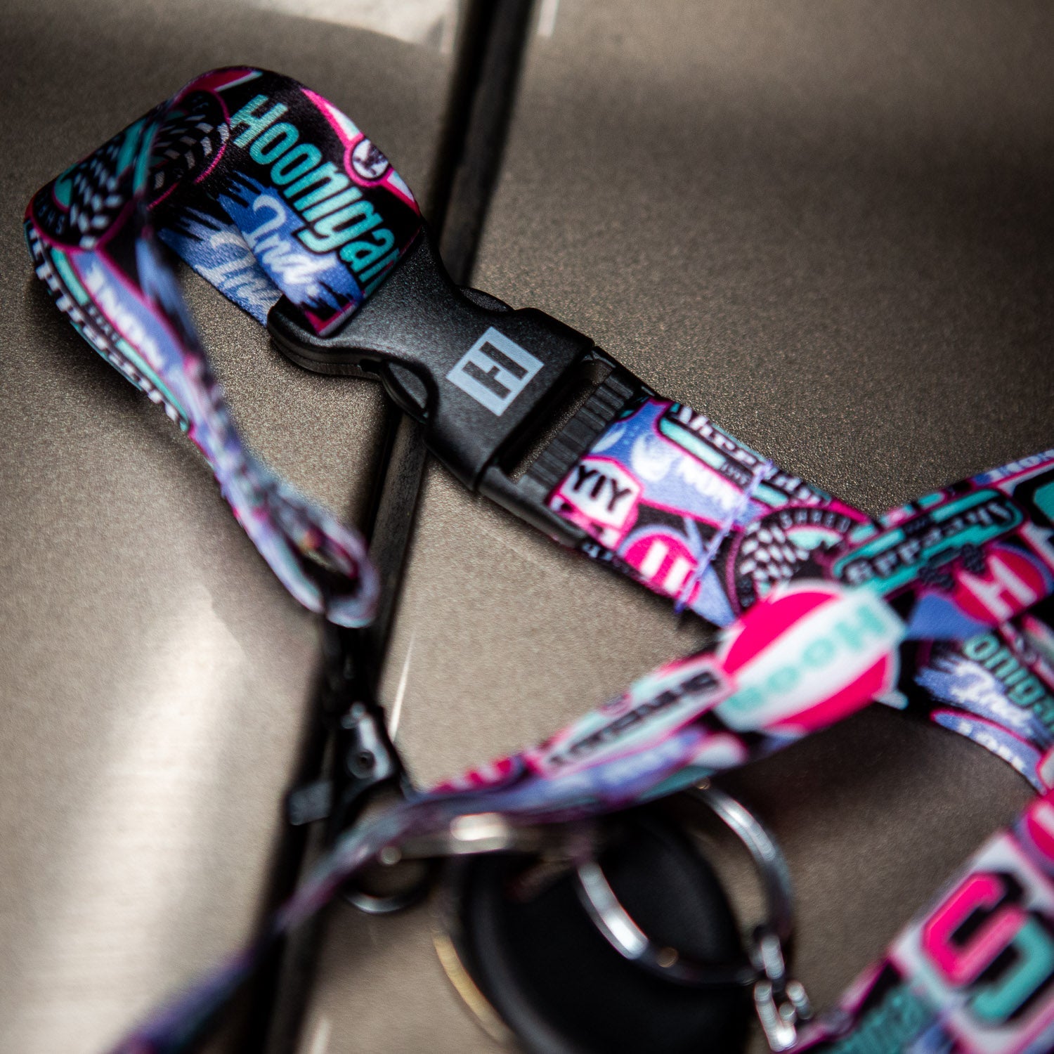 Hoonigan x Shreddy lanyard featuring vibrant graphics and a secure clip, perfect for motorsport enthusiasts.
