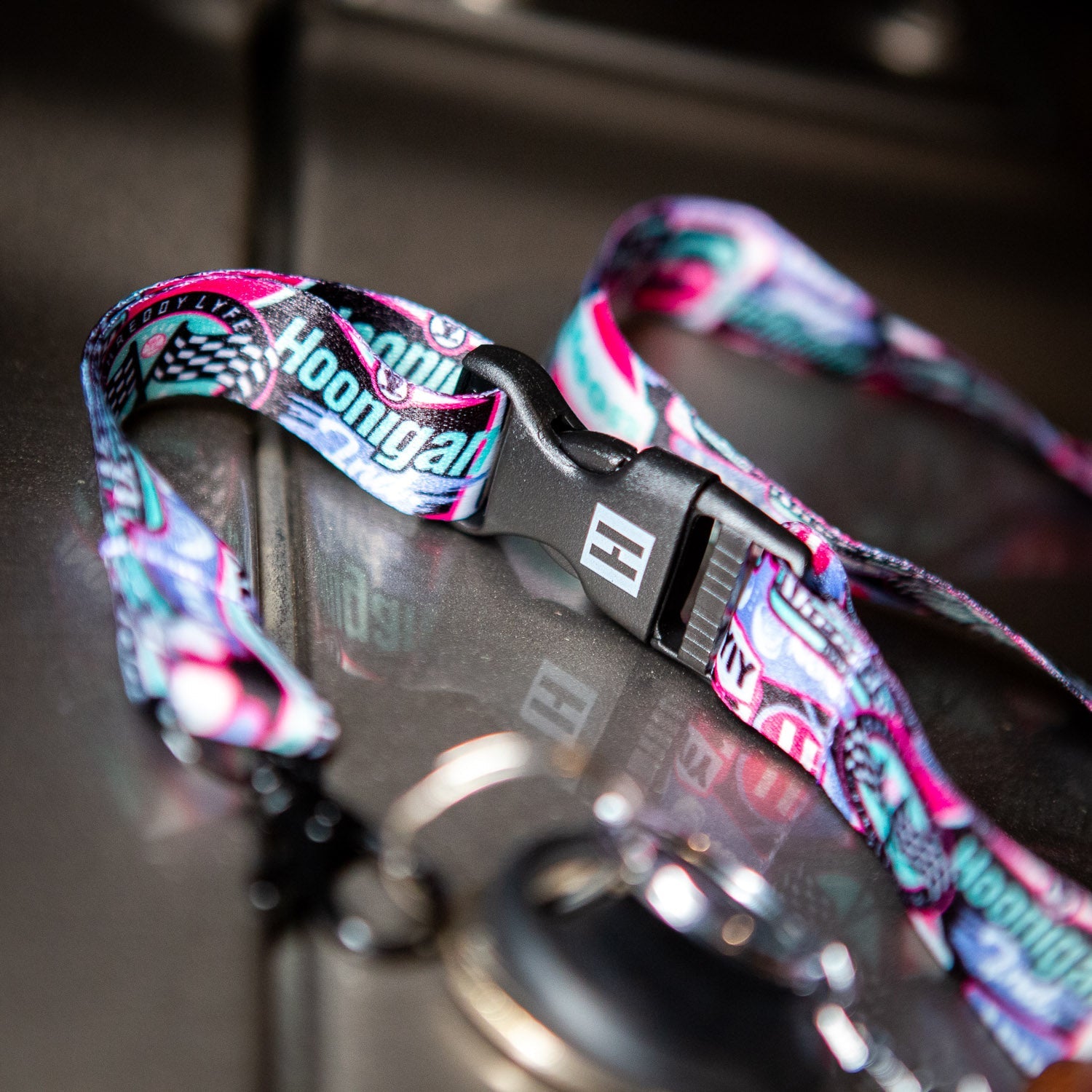 Colorful Hoonigan x Shreddy lanyard featuring bold graphics and a secure clip, perfect for motorsport enthusiasts.