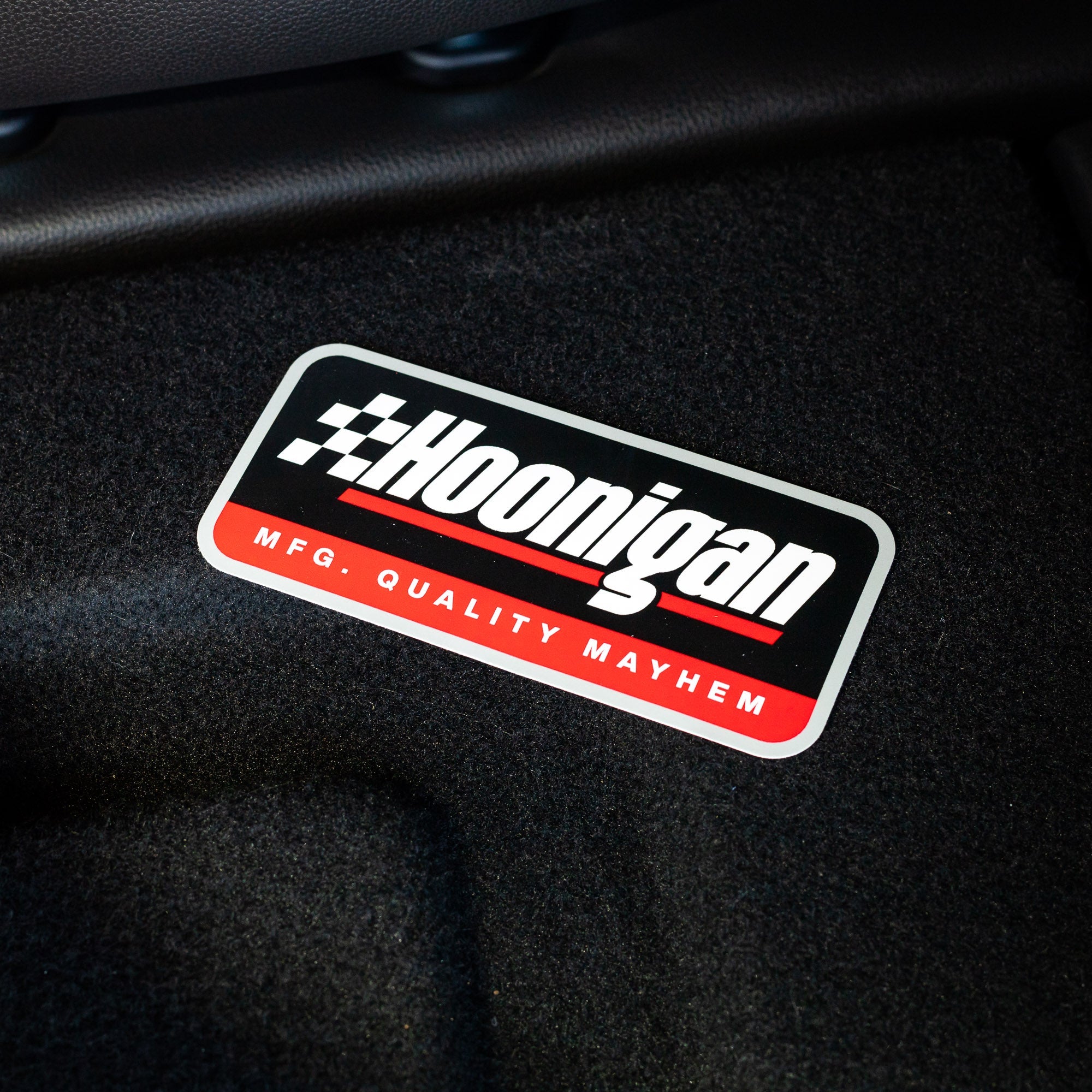 Hoonigan RACE DAY sticker featuring bold text and a checkered flag design, perfect for automotive enthusiasts.