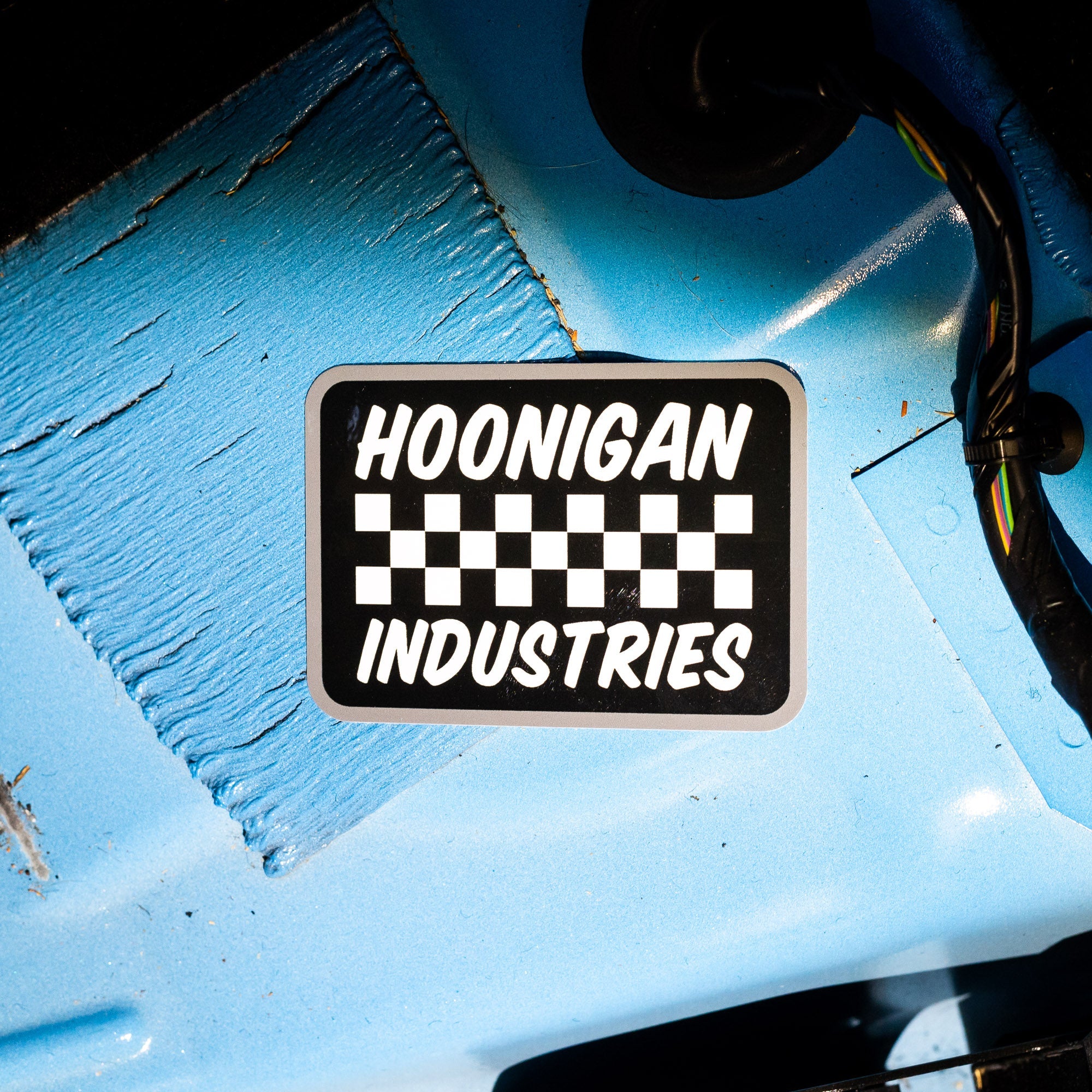 Hoonigan SPRINT sticker featuring a bold black and white design with checkered pattern and "Hoonigan Industries" text.