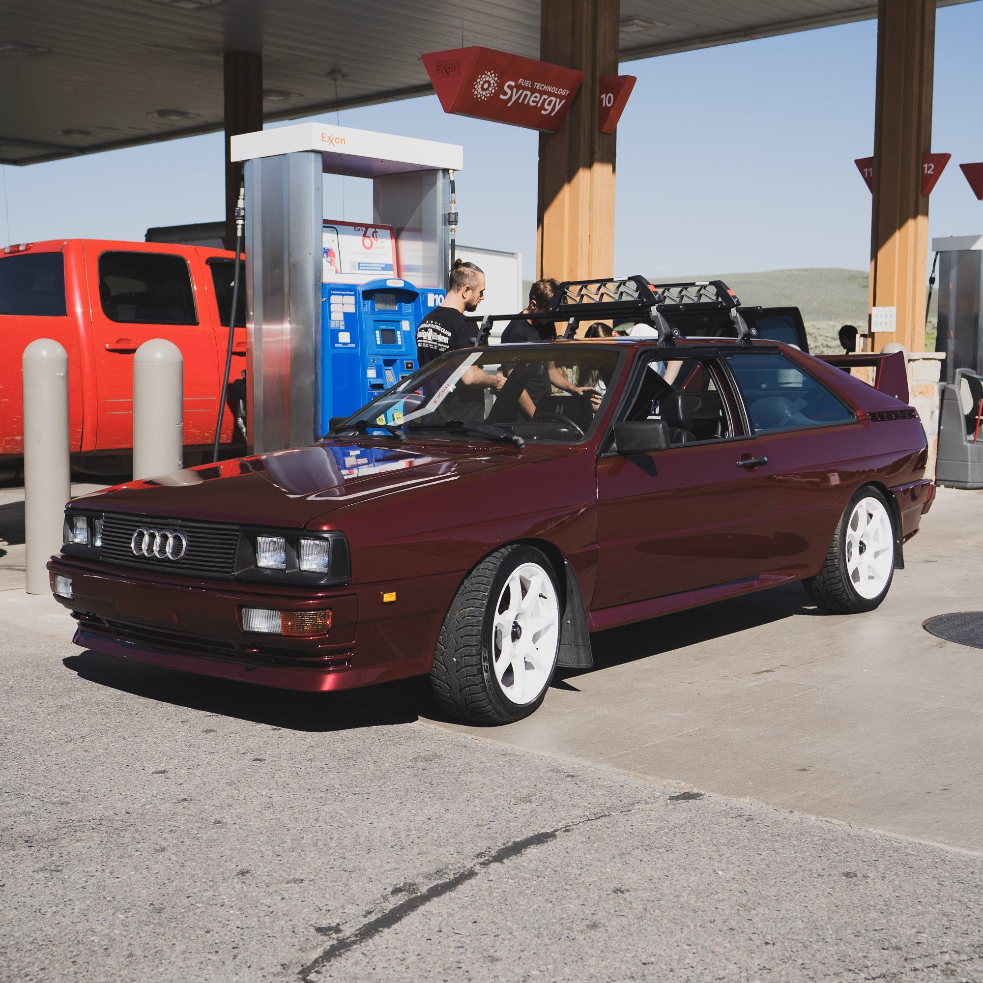Hoonigan x Lia Block INNER WORKINGS Short Sleeve T-Shirt featuring a classic Audi at a gas station, showcasing automotive culture.