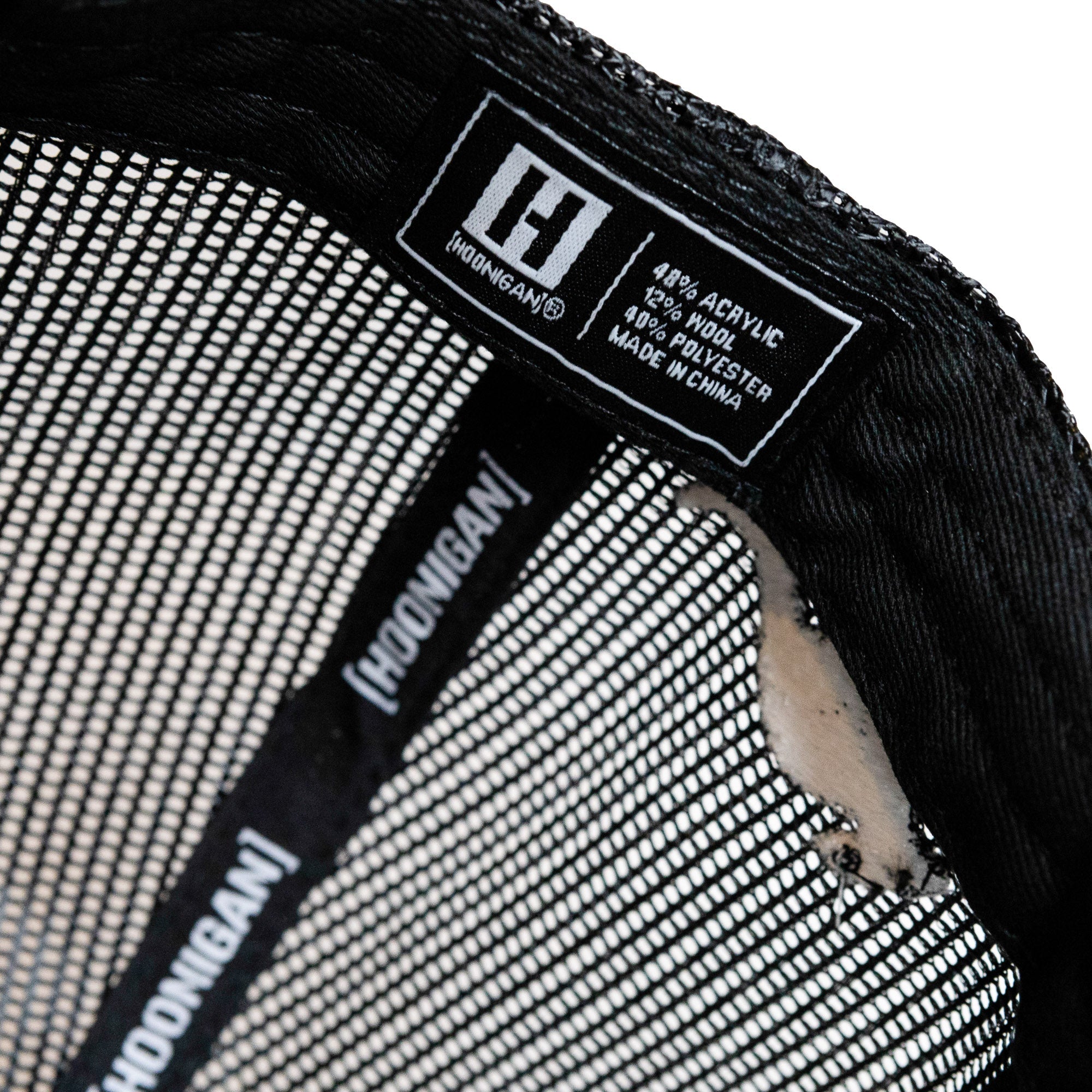 Inside view of Hoonigan GYMKHANA Aussie Shred Roll Call trucker strapback hat showcasing label and mesh design.