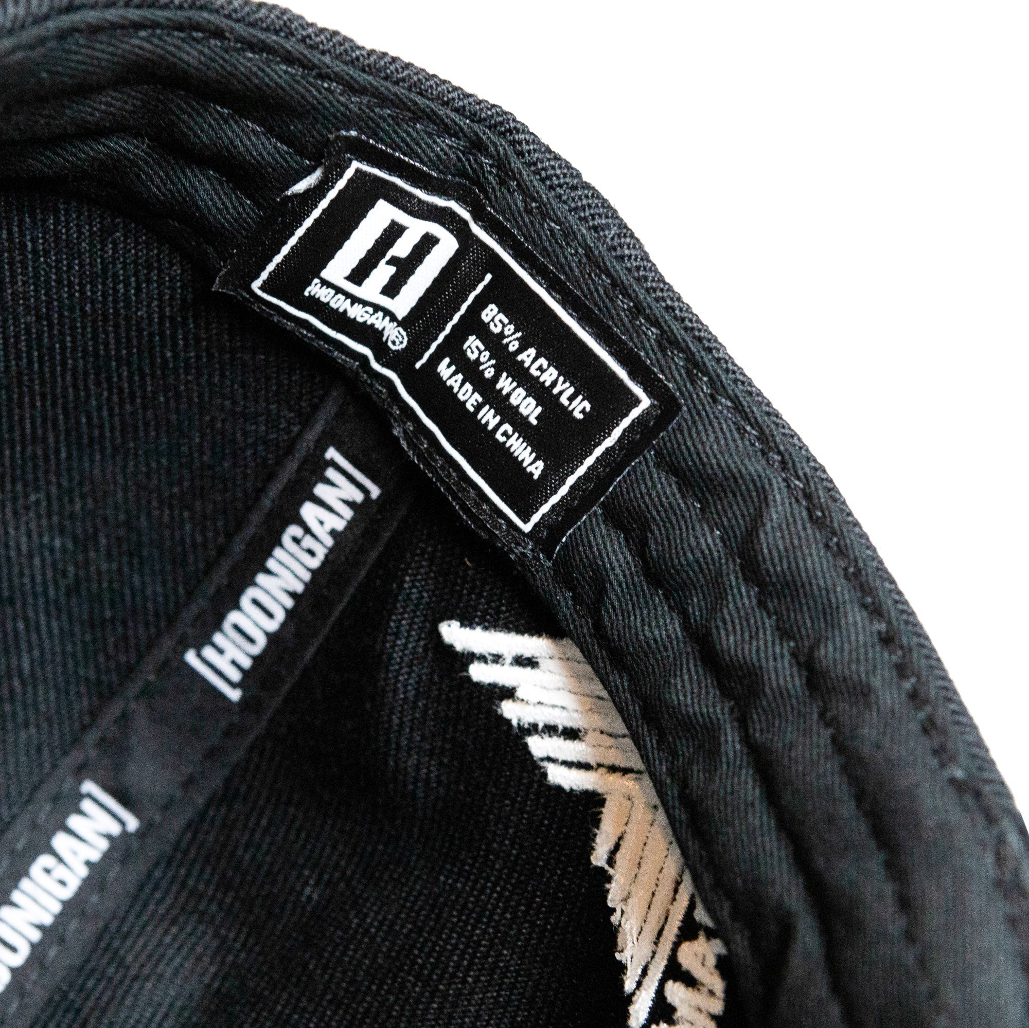 Inside view of Hoonigan GYMKHANA AUSSIE SHRED CENSOR BAR Snapback Hat showing fabric label and stitching details.