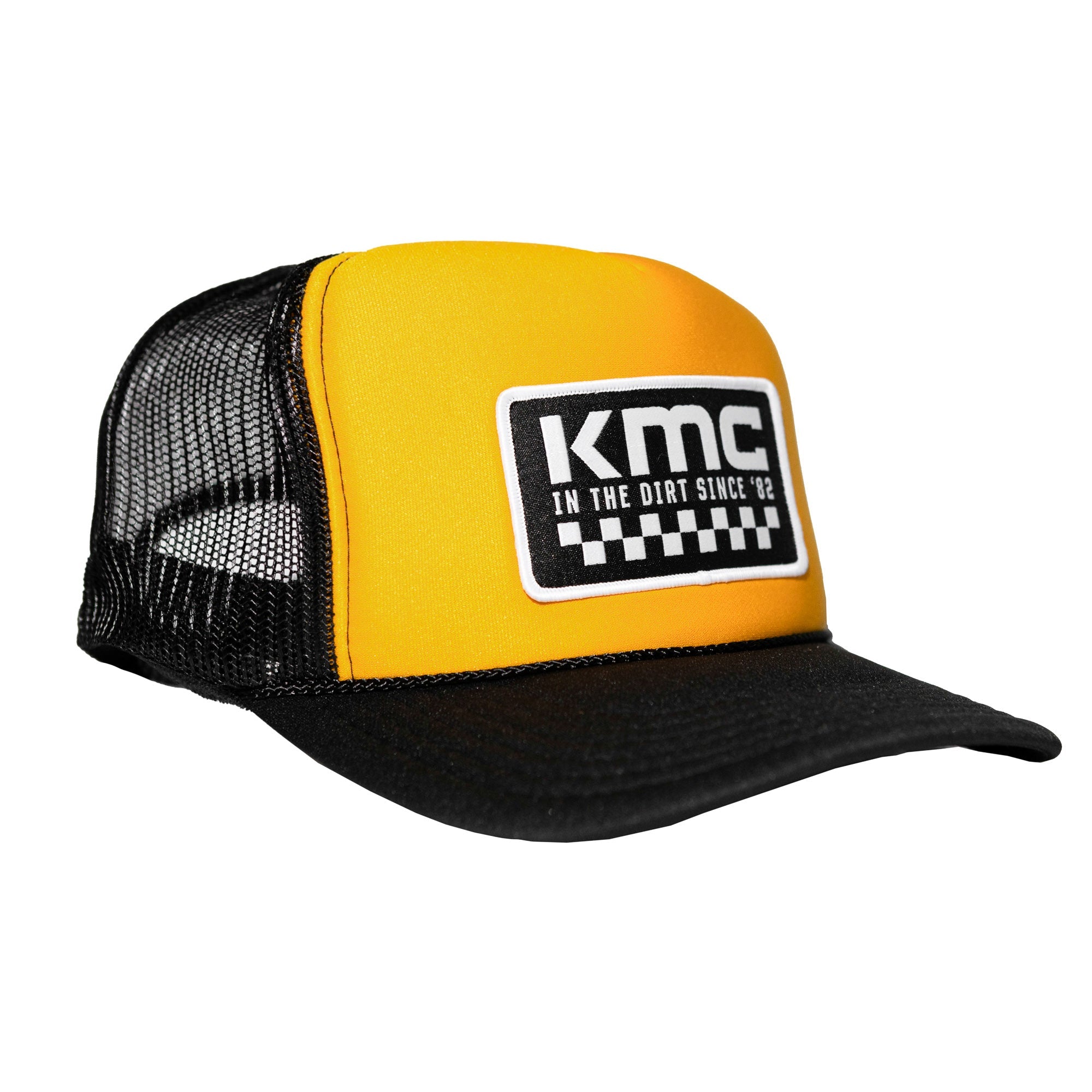 KMC In The Dirt Checkers Trucker Hat featuring a yellow front panel and black mesh back, perfect for motorsport enthusiasts.