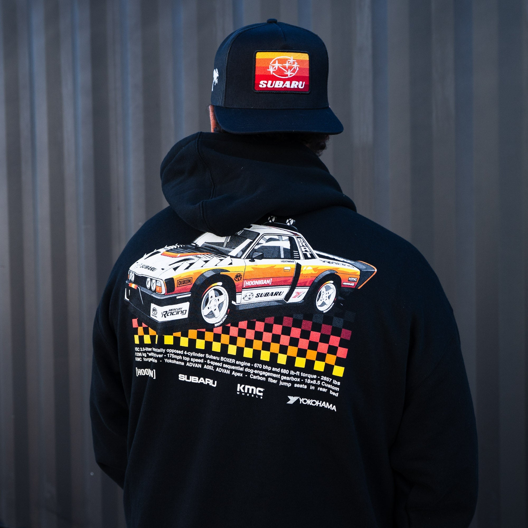 Hoonigan GYMKHANA AUSSIE SHRED BRAT Pullover Hoodie featuring a vintage Subaru graphic on the back. Perfect for motorsport fans.