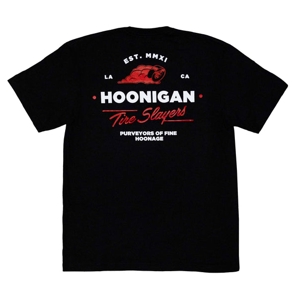 Black short sleeve t-shirt featuring Hoonigan logo and "Tire Slayers" graphic on the back, designed for motorsport enthusiasts.