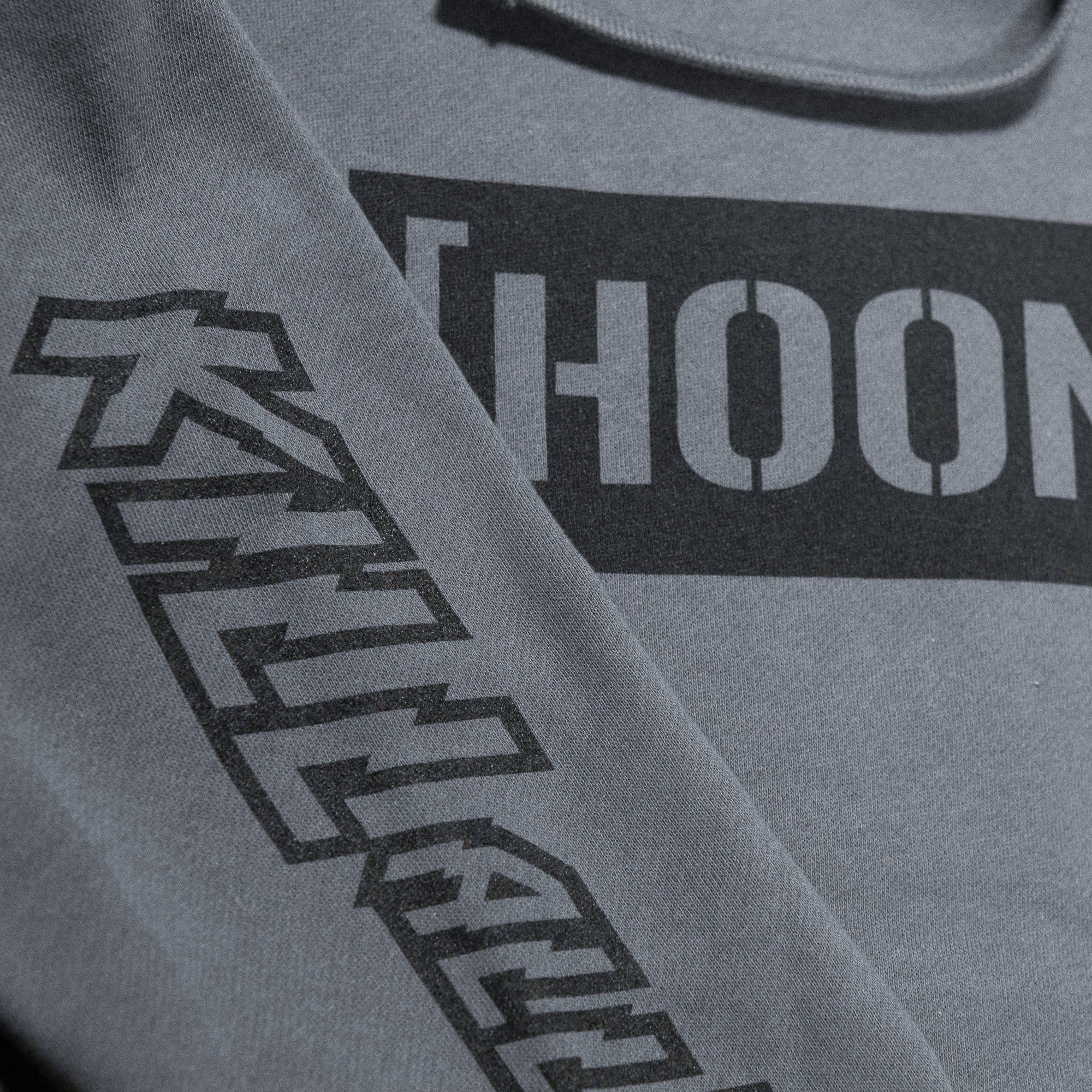 Gray pullover hoodie featuring bold "Hoonigan" logo and "Kill All Tires" graphic on the sleeve for motorsport enthusiasts.