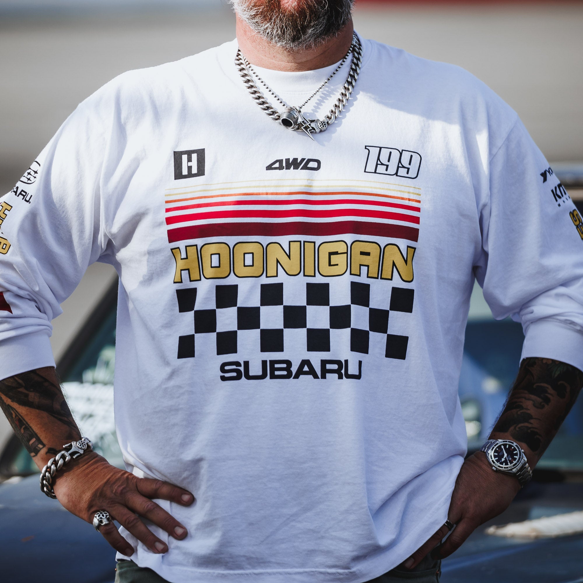 Hoonigan GYMKHANA AUSSIE SHRED Team Long Sleeve T-Shirt featuring bold graphics and a checkered design, perfect for motorsport fans.