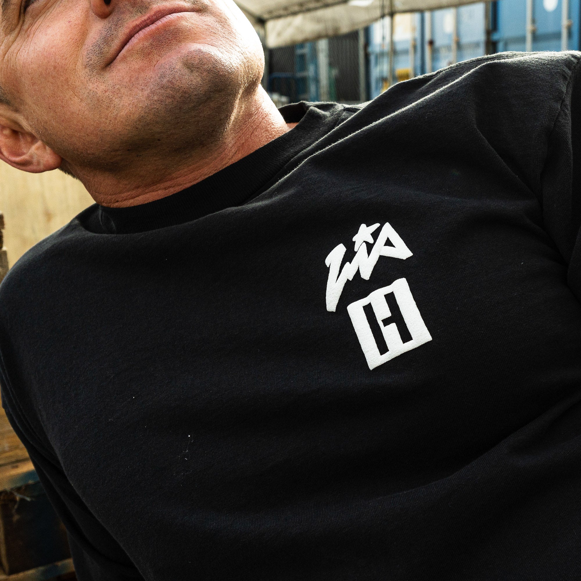 Black short sleeve t-shirt featuring Hoonigan and Lia Block logos, perfect for motorsport enthusiasts.