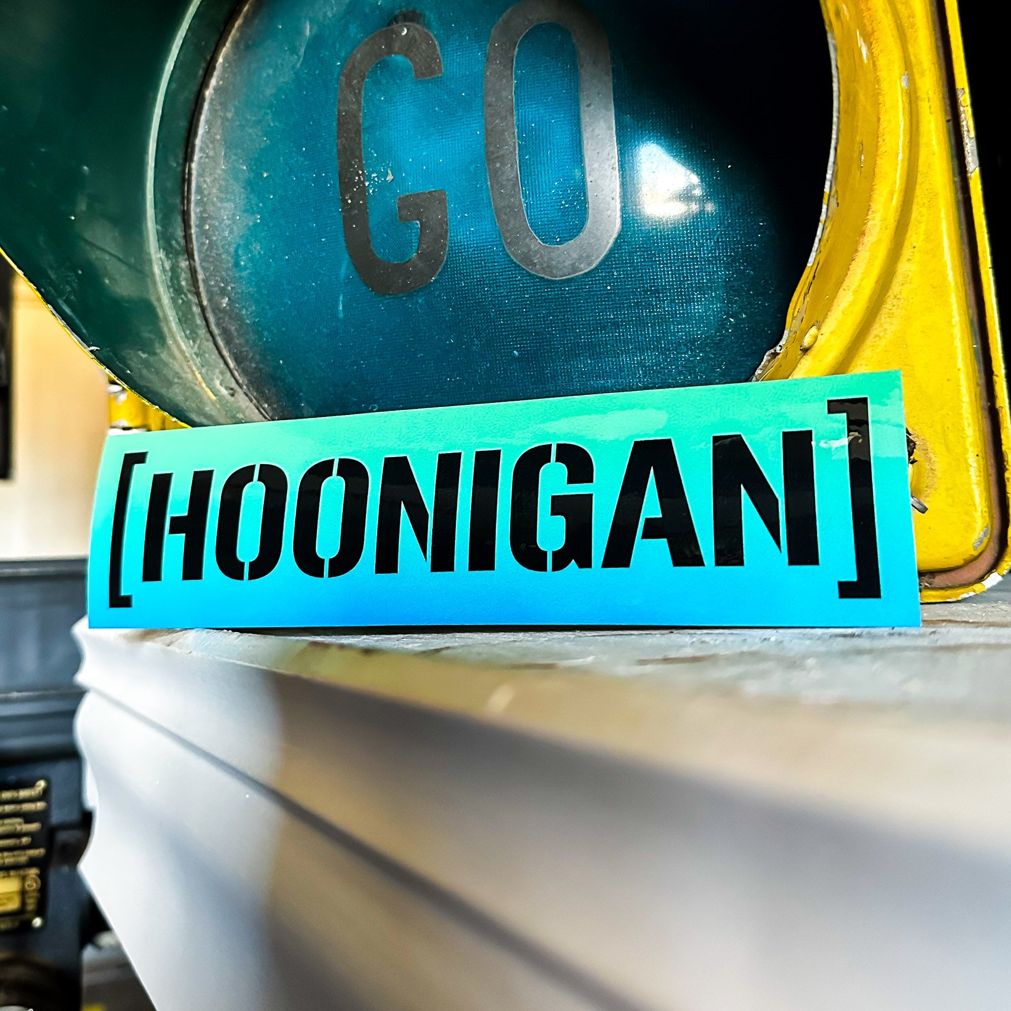 Hoonigan SHIFT CENSOR BAR sticker in bold black text on a vibrant blue background, ideal for automotive enthusiasts.