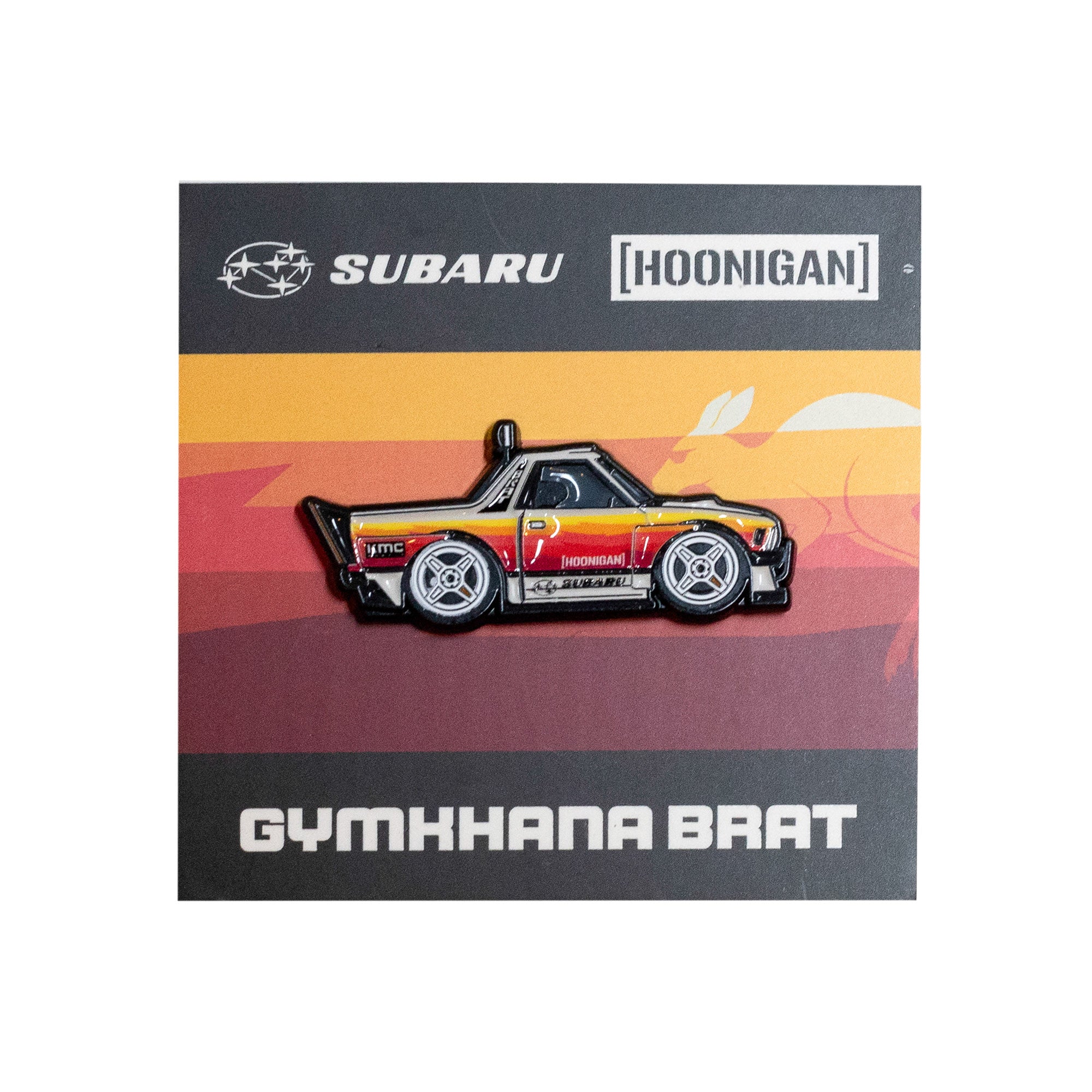 Hoonigan x Leen Customs GYMKHANA BRAT collectible pin featuring a stylized Subaru truck design on a vibrant background.