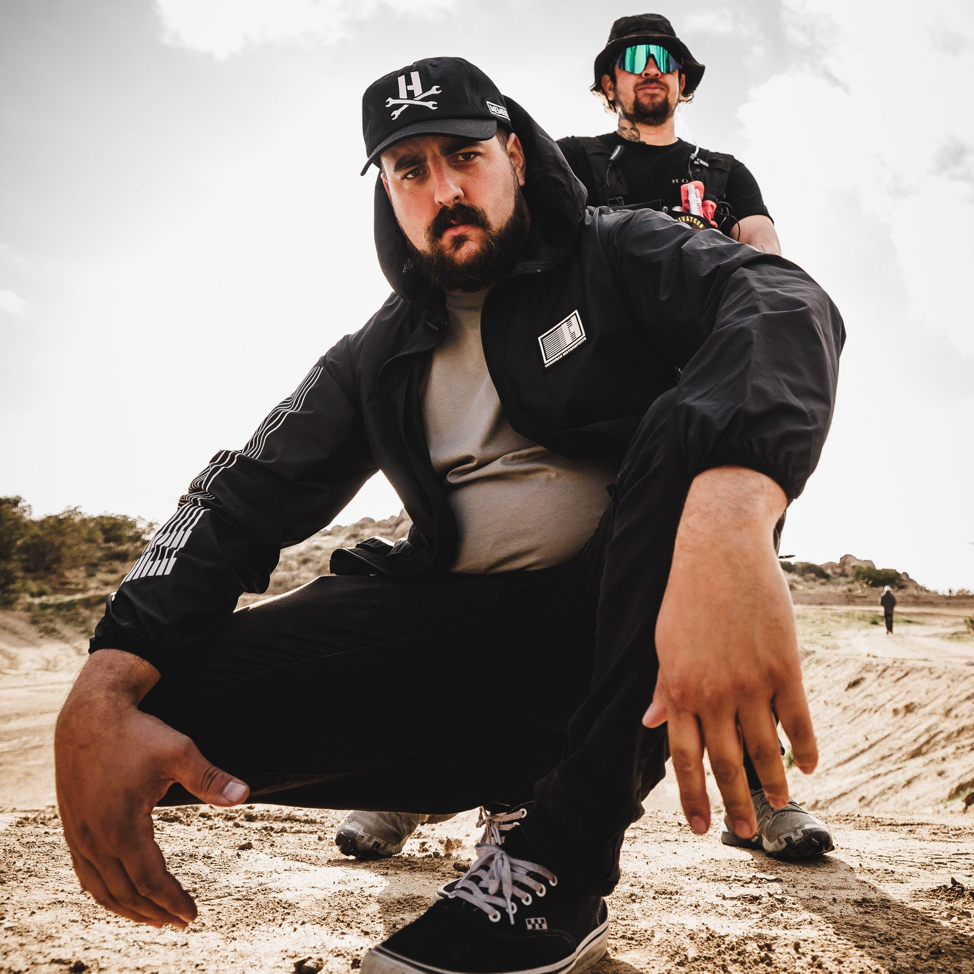 Hoonigan MAYHEM unstructured strapback hat with logo, black fabric, and adjustable rear strap.