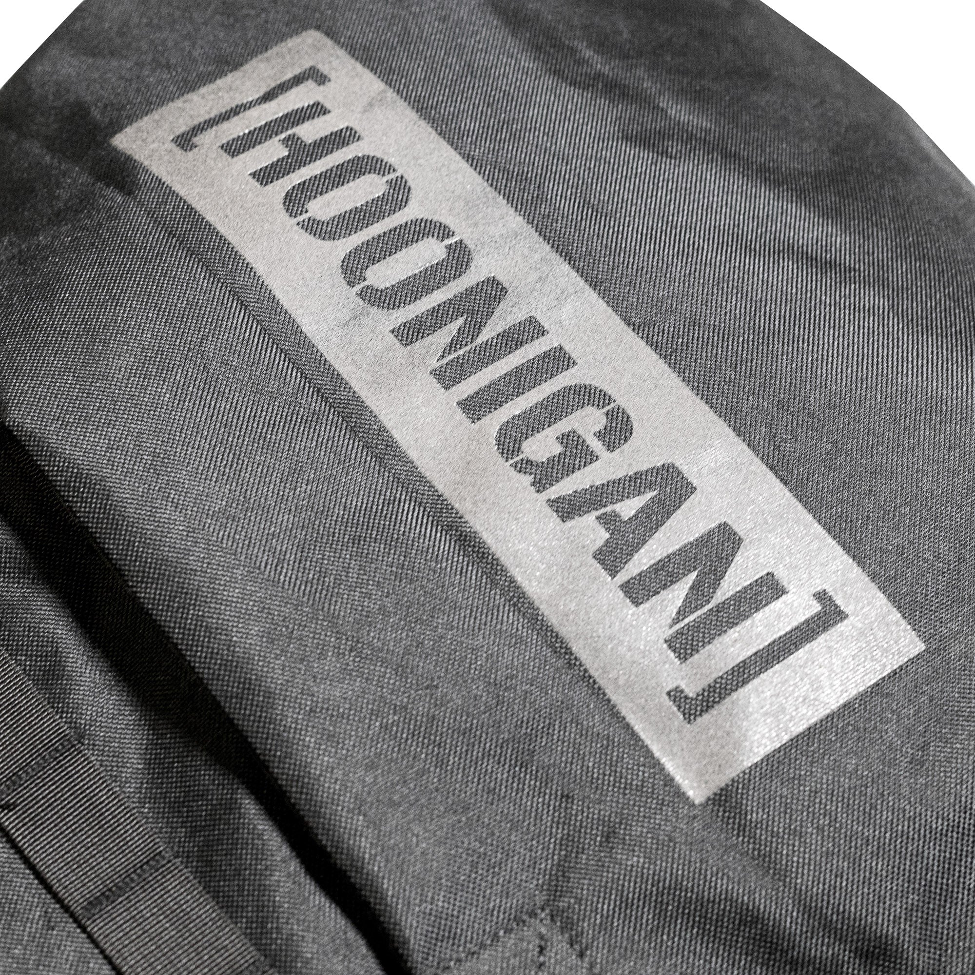 Hoonigan CENSOR BAR backpack featuring a durable design, perfect for carrying gear on tailgates or spare tires.