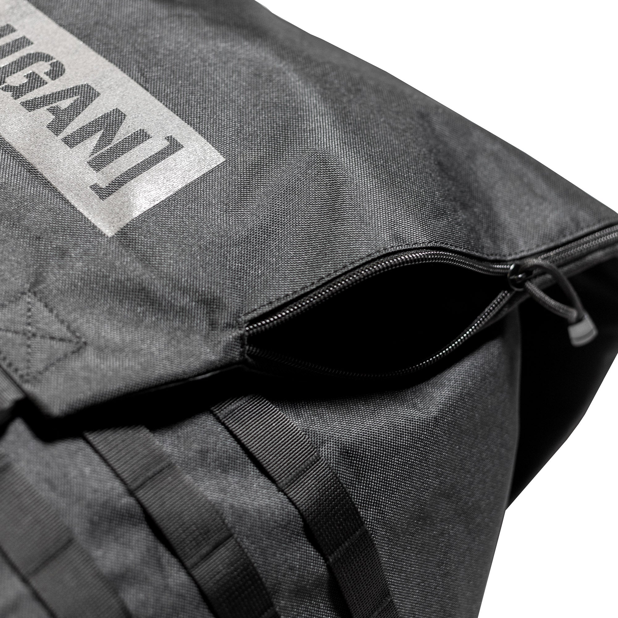 Close-up of the Hoonigan CENSOR BAR backpack featuring a zippered opening and durable fabric, ideal for automotive enthusiasts.