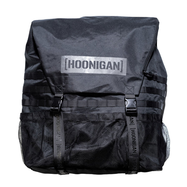 Hoonigan CENSOR BAR spare tire backpack features a sleek black design with adjustable straps and mesh pockets for storage.