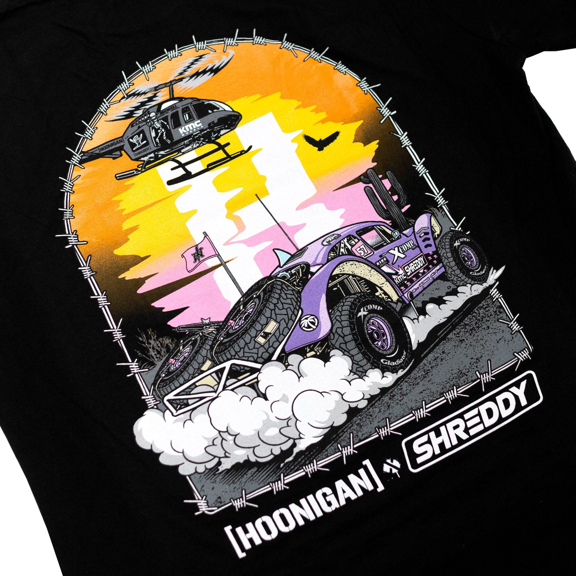 Hoonigan x Shreddy short sleeve t-shirt featuring a vibrant graphic of a desert scene with a car and helicopter.