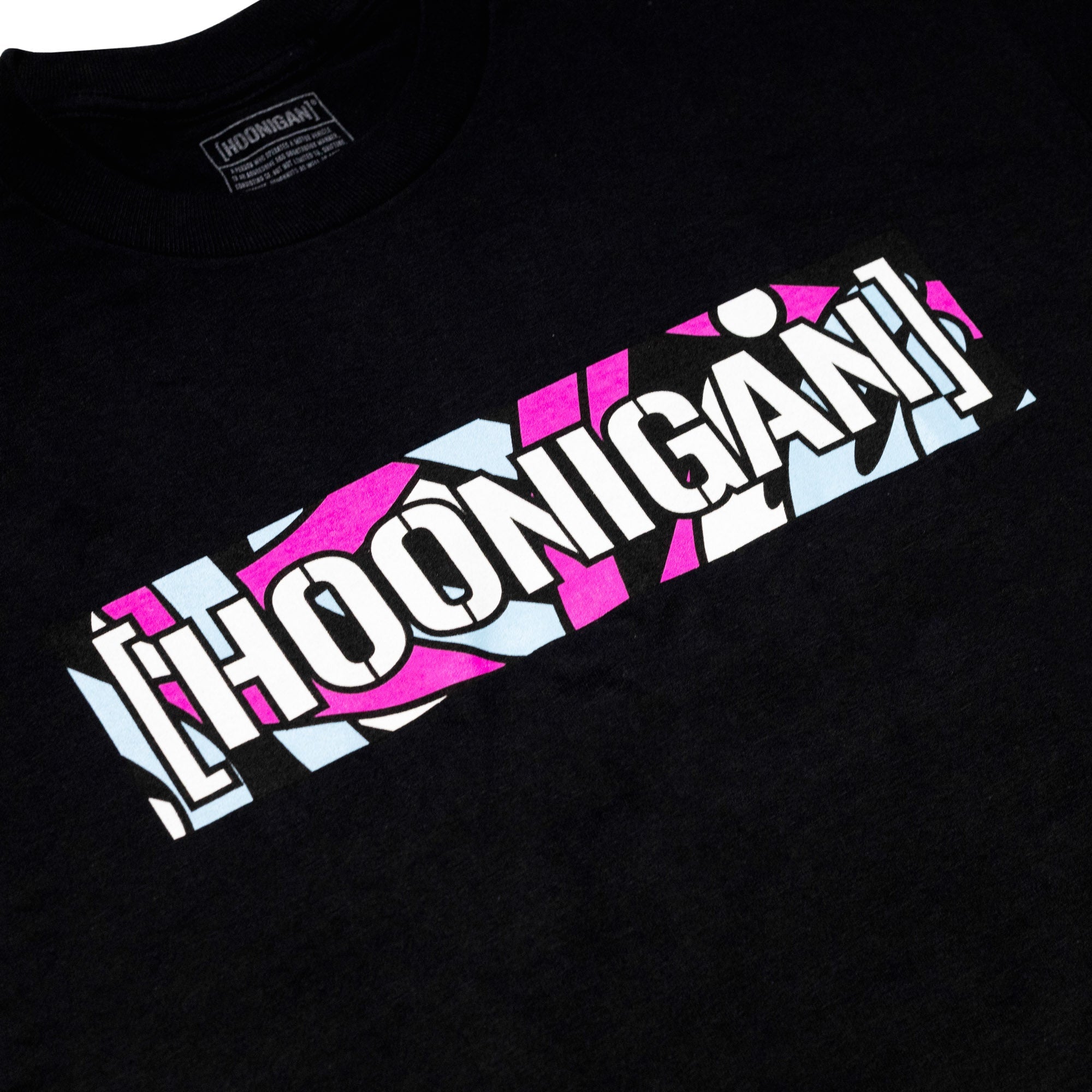 Black short sleeve t-shirt featuring a colorful Hoonigan logo with a bold design, celebrating automotive culture.