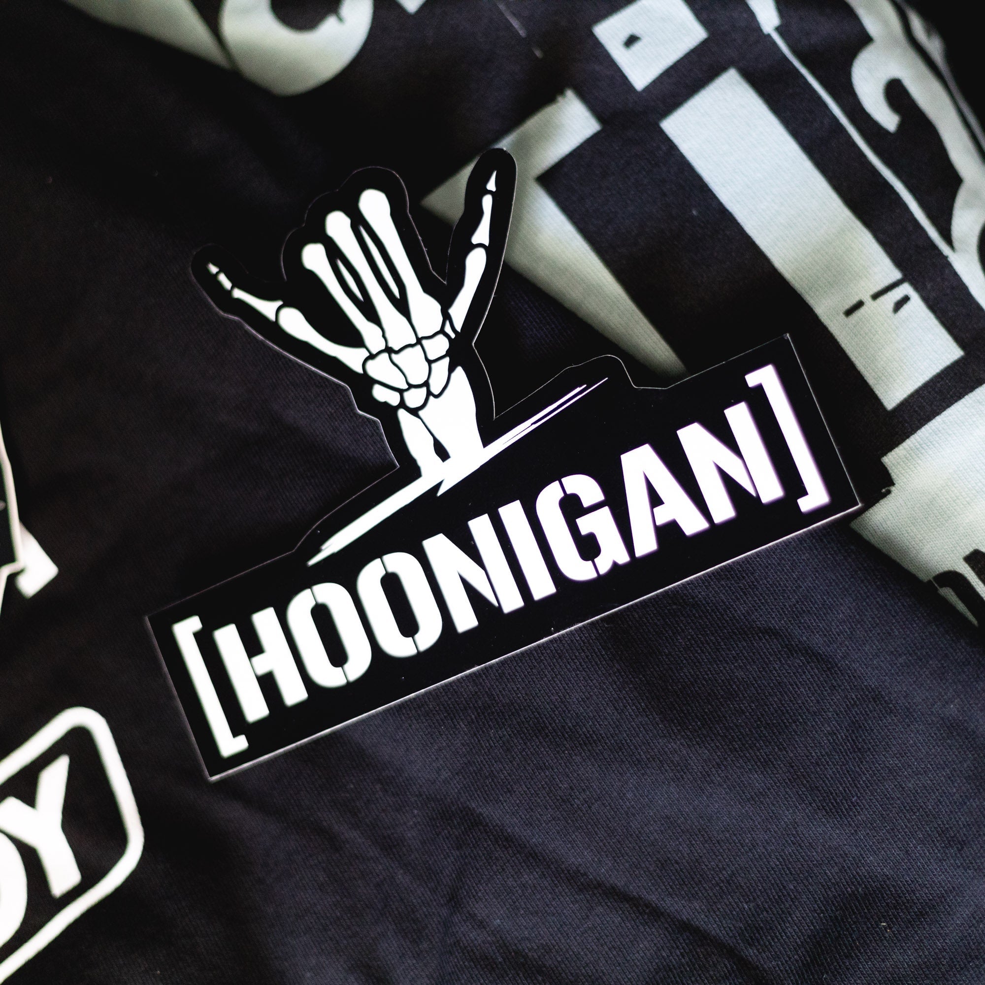 Hoonigan x Shreddy CENSOR BAR sticker featuring a bold design with a skeleton hand and the Hoonigan logo.