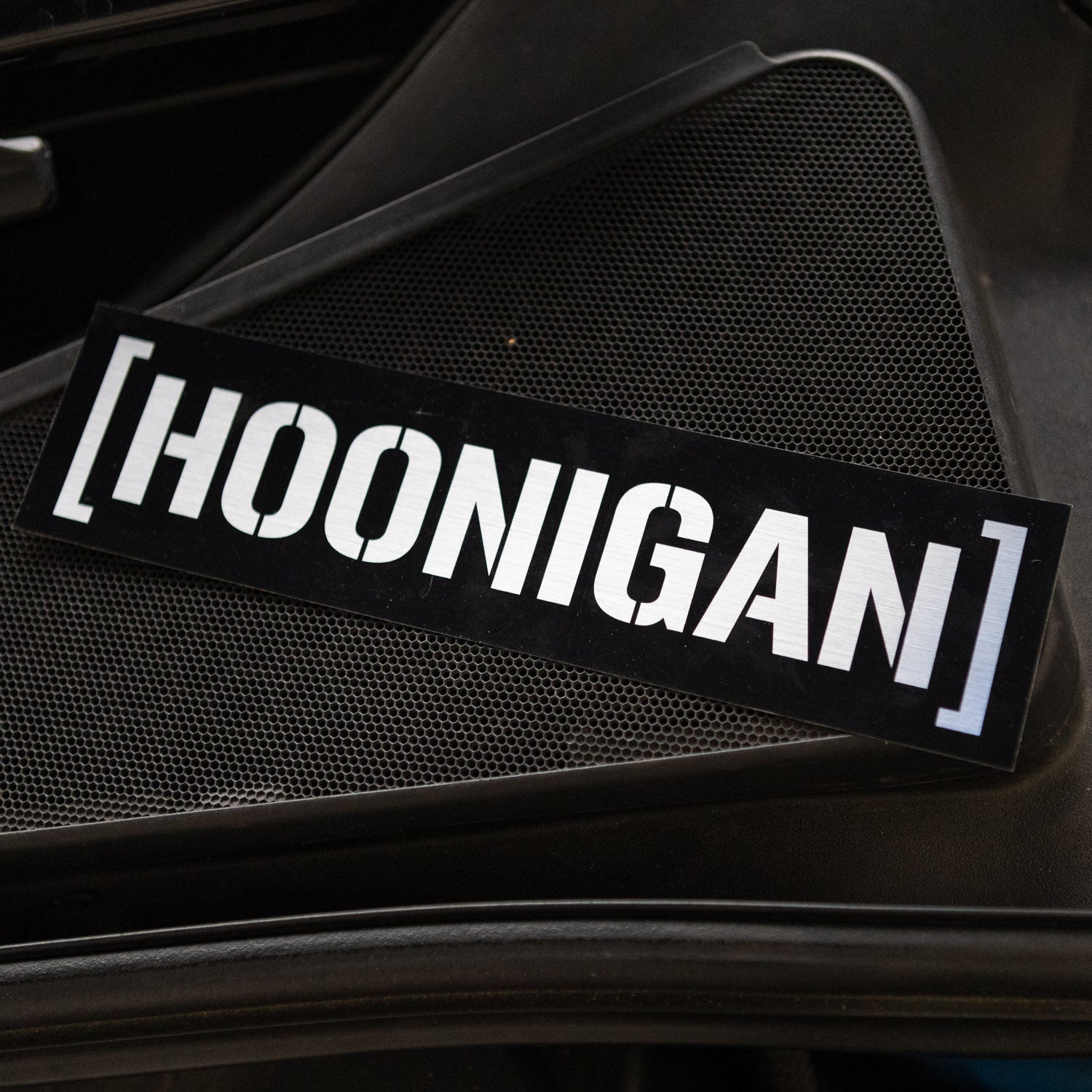 Black Hoonigan CENSOR BAR sticker displayed on a textured surface, perfect for automotive enthusiasts and car culture fans.