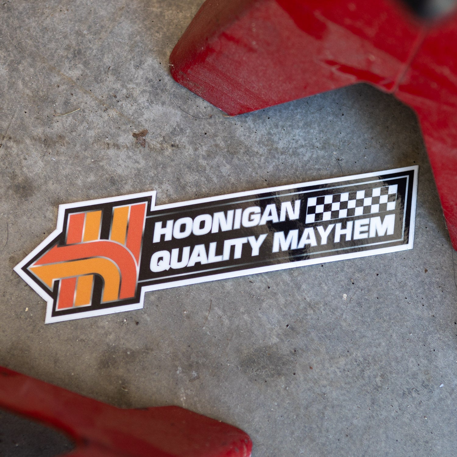 Hoonigan HNX sticker featuring an arrow design with "Hoonigan Quality Mayhem" text, perfect for automotive enthusiasts.