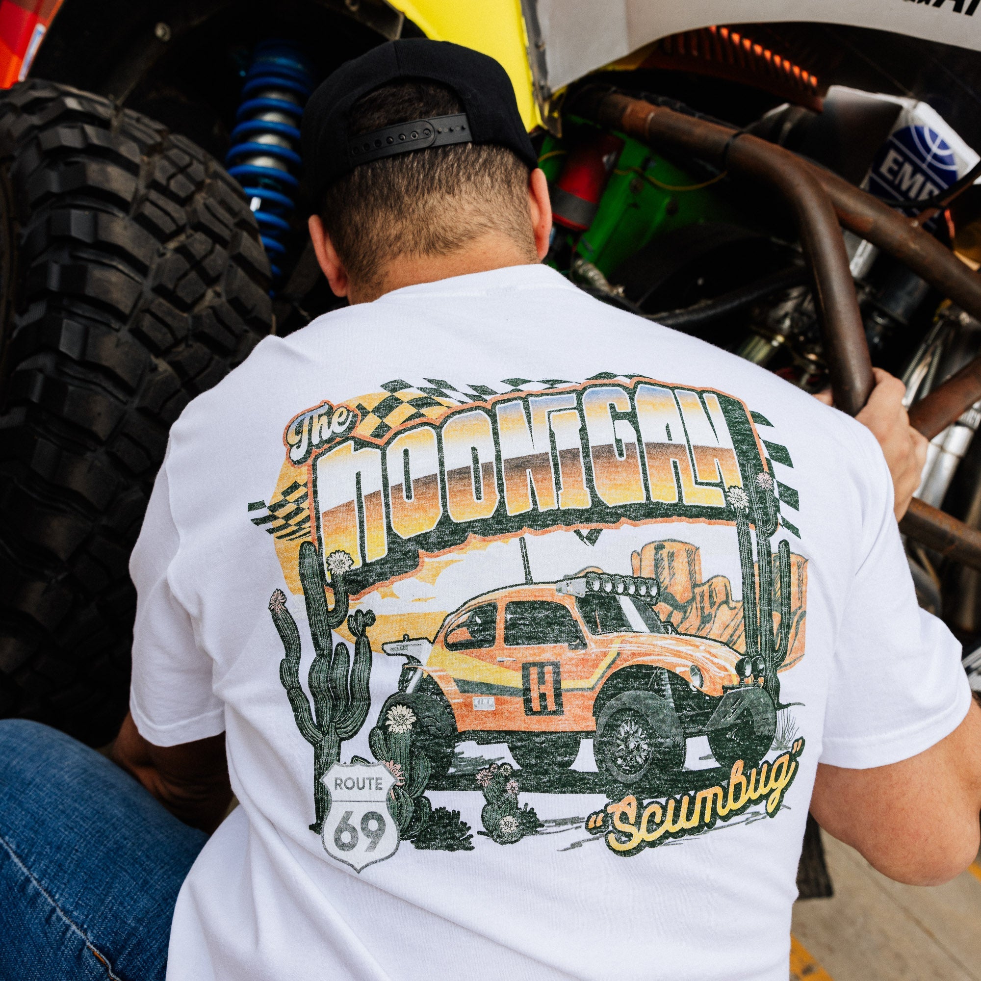 Hoonigan SCUMBUG short sleeve t-shirt featuring a vintage off-road vehicle design with cacti and Route 69 signage.
