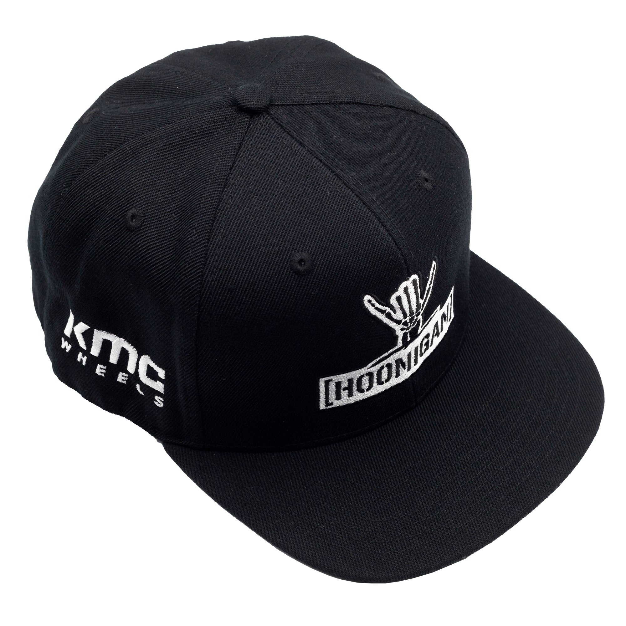Black snapback hat featuring Hoonigan logo and KMC Wheels branding, perfect for motorsport enthusiasts.